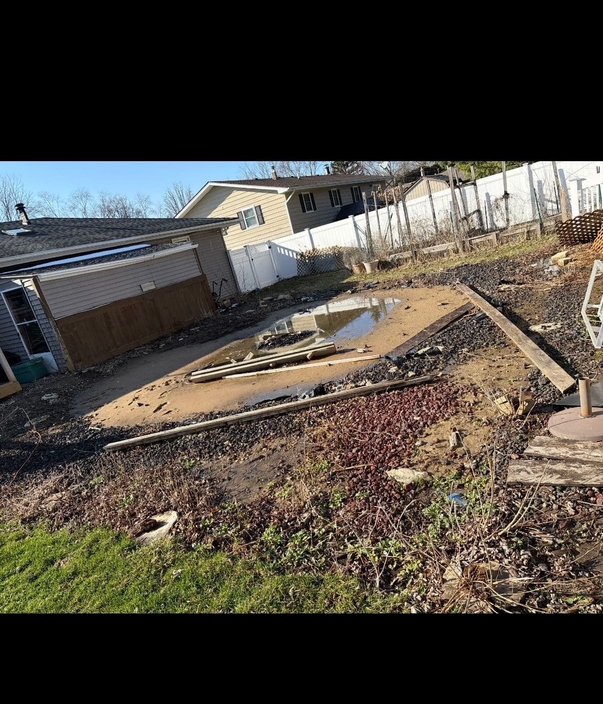 Muddy Backyard Gets a Paver Patio and Fire Pit Upgrade image